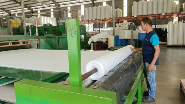 Operator rolling finished polyester wadding